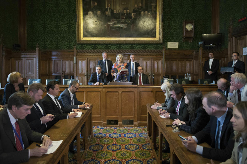 Back row from left, Charles Walker, Bob Blackman, Dame Cheryl Gillan, Nigel Evans and Geoffrey Clifton-Brown announce the results of the fifth ballot in the Tory leadership ballot at the Houses of Parliament in Westminster, London, Thursday, June 20, 2019. Boris Johnson and Jeremy Hunt will compete to become Britain's next prime minister in a runoff vote by members of the governing Conservative Party. (Stefan Rousseau/PA via AP)