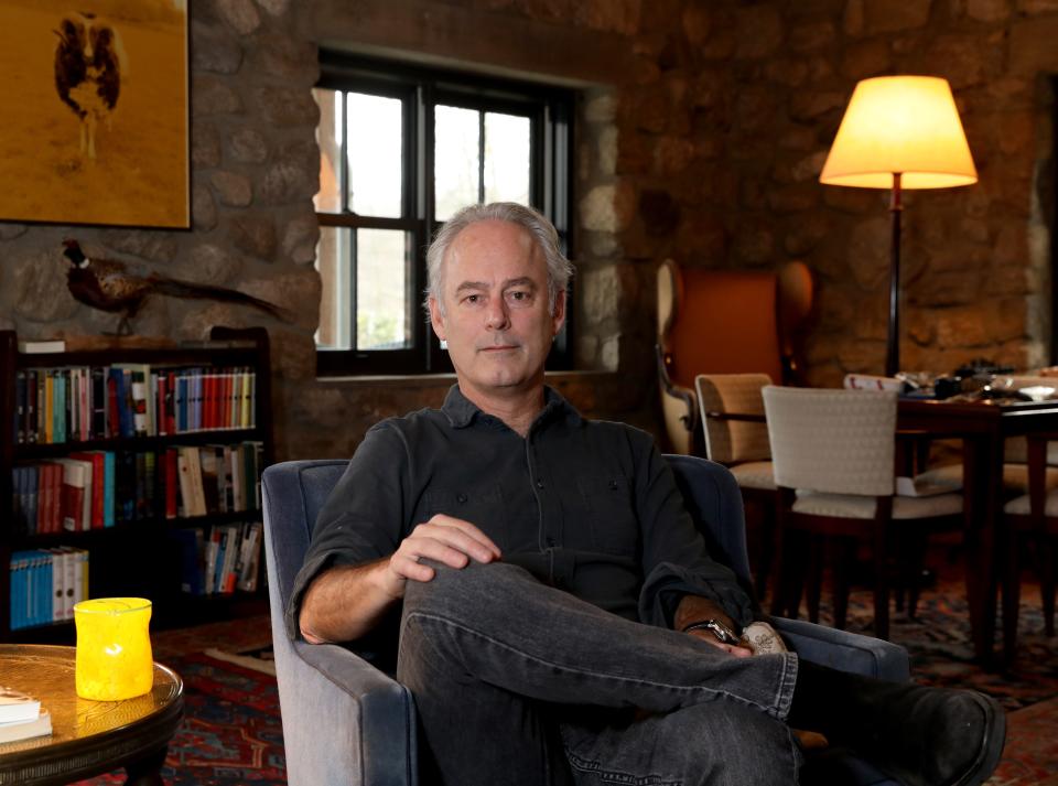 Novelist Amor Towles at his retreat in Garrison, N.Y., on Feb. 23 2024. An adaptation of Towles' second novel, u0022A Gentleman in Moscow,u0022 premieres on Showtime and Paramount+ and his latest novel, u0022Table for Two,u0022 hits stores April 2. Towles bought the home about a decade ago. When he saw the massive great room overlooking the private lake, it was so reminiscent of the home he created in his debut novel, u0022Rules of Civility,u0022 that he said: u0022I wrote this room.u0022