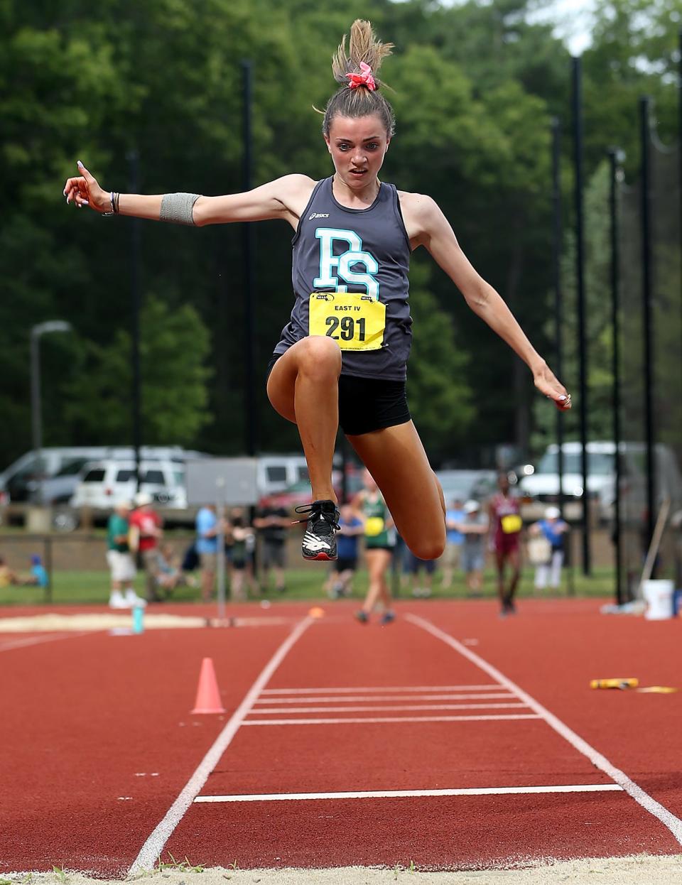 Plymouth South’s Katrina Sullivan leaps out during the triple jump during the Division 2 south track and field meet at Notre Dame Academy in Hingham on Saturday, June 19, 2021.