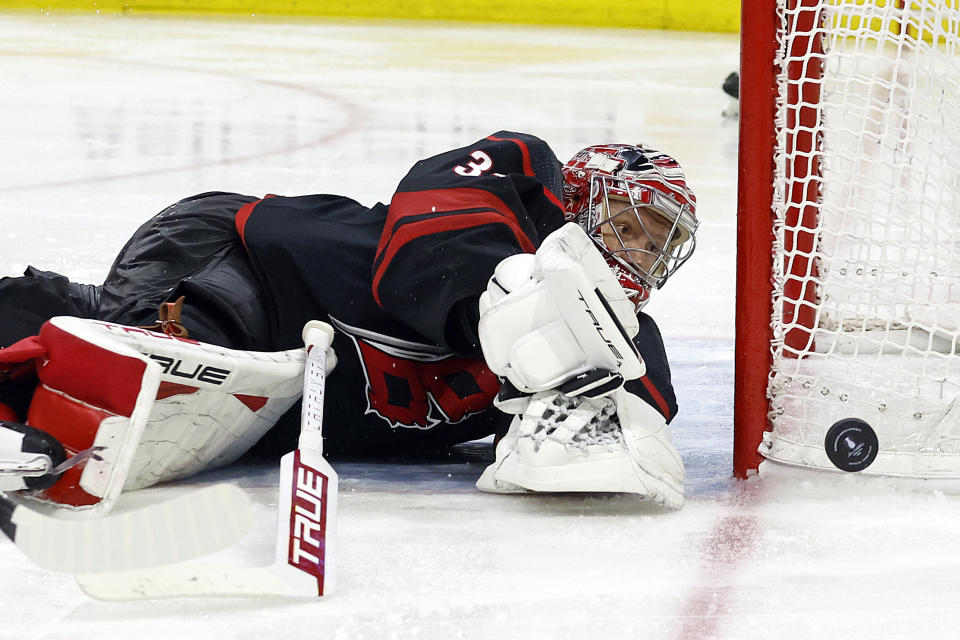 Carolina Hurricanes goaltender Frederik Andersen blocks a shot by the New York Islanders during the third period in Game 1 of an NHL hockey Stanley Cup first-round playoff series in Raleigh, N.C., Saturday, April 20, 2024. (AP Photo/Karl B DeBlaker)