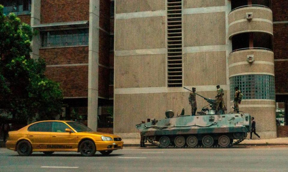 An armoured personnel carrier parked on a street in Harare