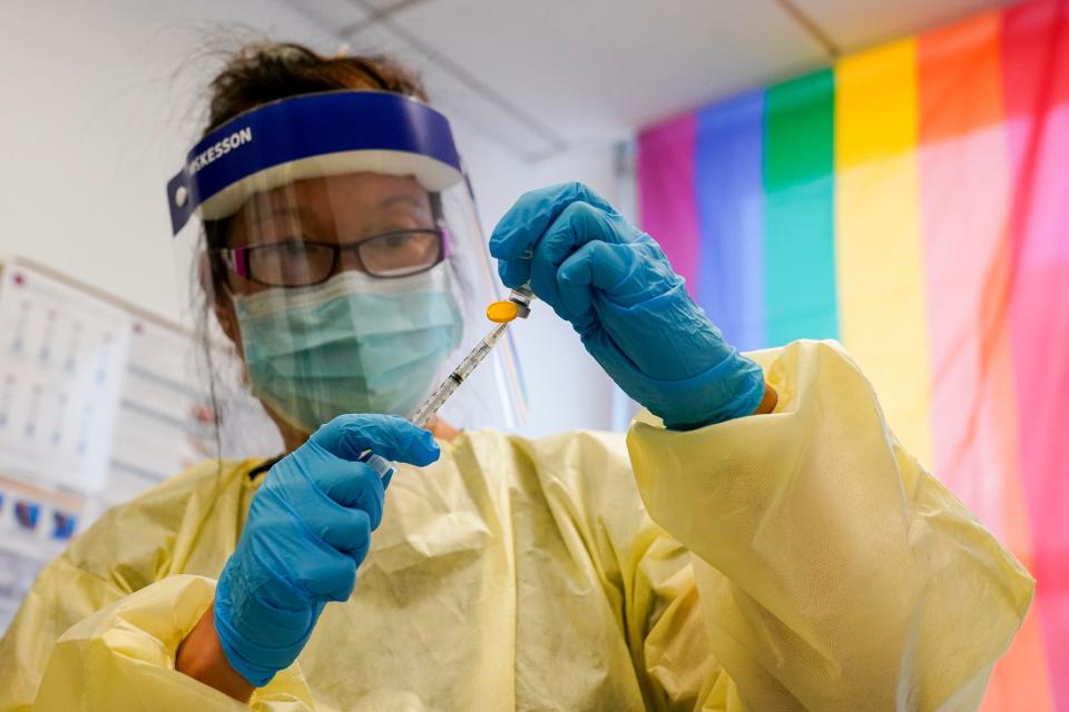 Physician assistant Susan Eng-Na prepares a string with the monkeypox vaccine before inoculating a patient at a vaccination clinic in New York earlier this month.