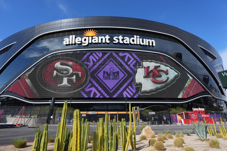 A view of San Francisco 49ers and Kansas City Chiefs logos on the Allegiant Stadium facade.