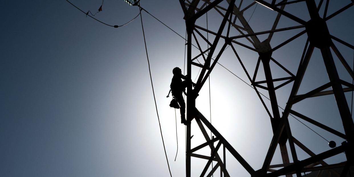 French electricity transmission system operator RTE employees work on renovating high voltage lines.