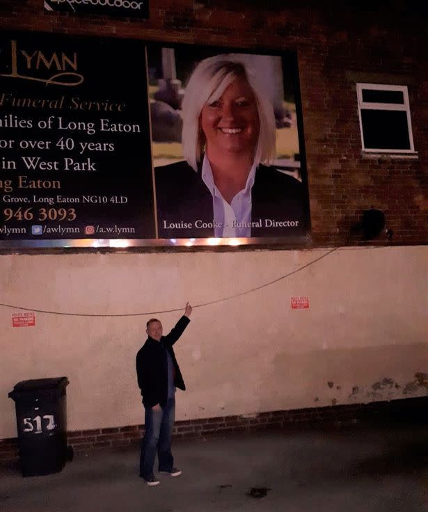 Mick sent Louise a picture of himself next to the huge billboard featuring her face. (Reach)