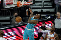Charlotte Hornets guard Malik Monk (1) dunks against the Phoenix Suns during the second half of an NBA basketball game, Wednesday, Feb. 24, 2021, in Phoenix. (AP Photo/Matt York)