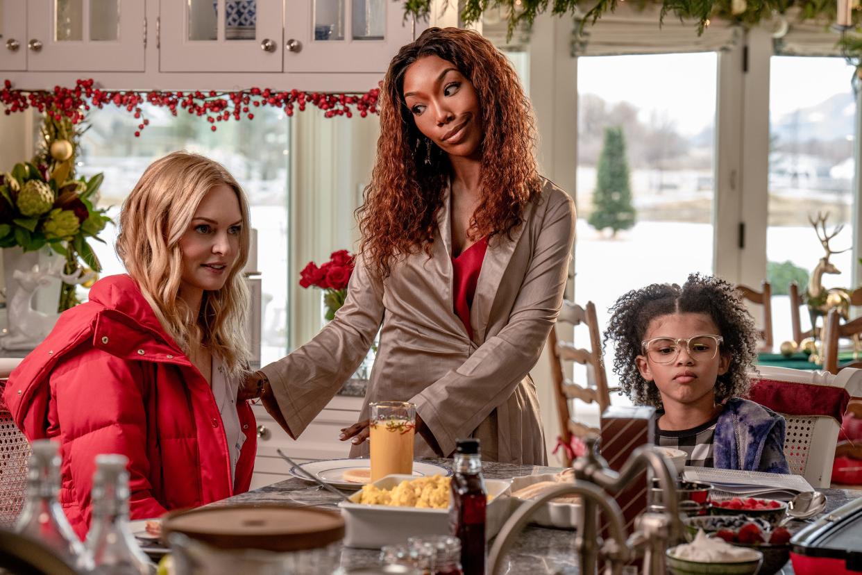 Charlotte (Heather Graham, far left) is put in an awkward situation when she ends up spending Christmas with an old friend (Brandy Norwood) and her genius daughter (Madison Skye Validum) in the holiday comedy "Best. Christmas. Ever!"