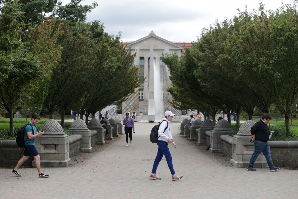 Students walk across Purdue University's campus, Thursday, Oct. 7, 2021 in West Lafayette.