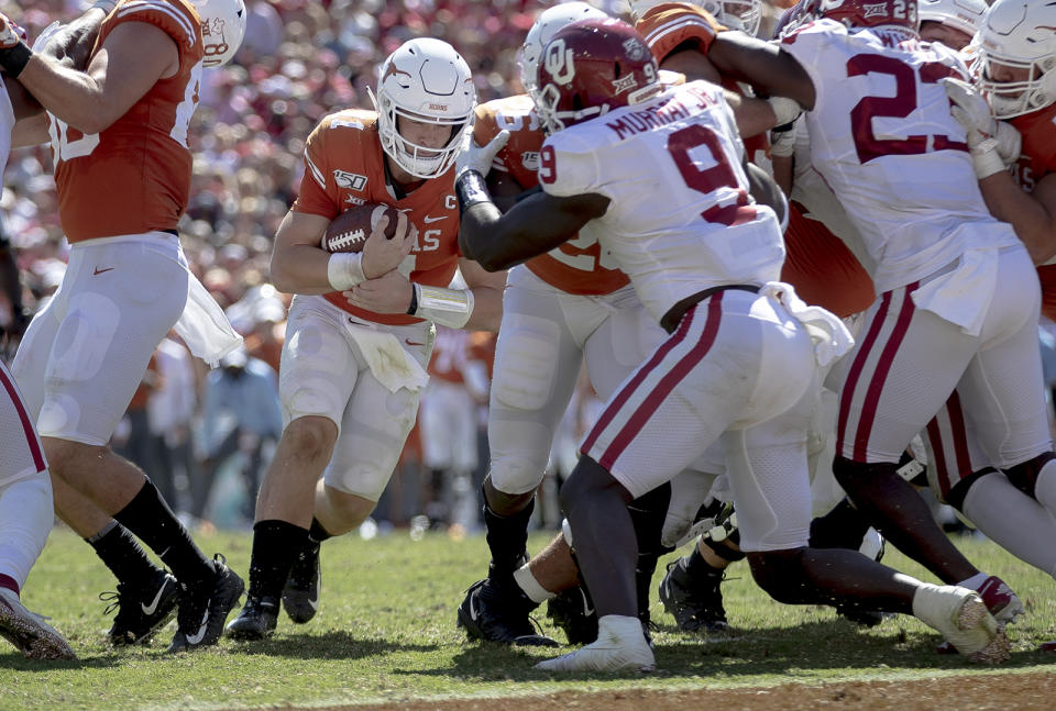 Texas quarterback Sam Ehlinger (11) runs the ball for a touchdown against Oklahoma during an NCAA college football game at the Cotton Bowl on Saturday, Oct. 12, 2019, in Dallas, Texas. (Nick Wagner/Austin American-Statesman via AP)