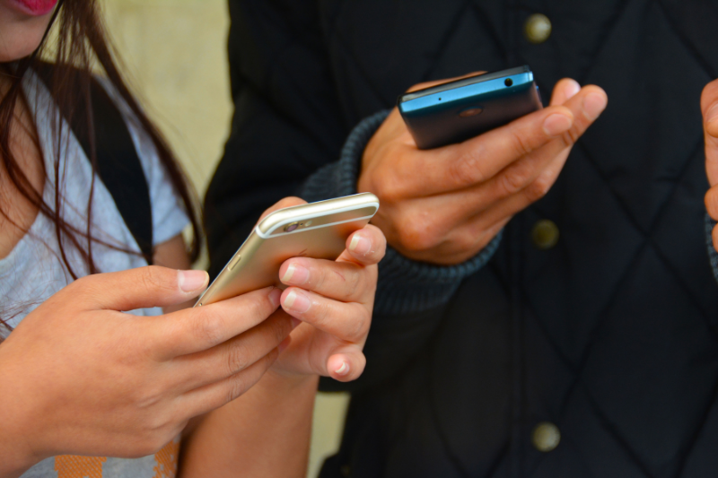 People Checking Mobile Phones