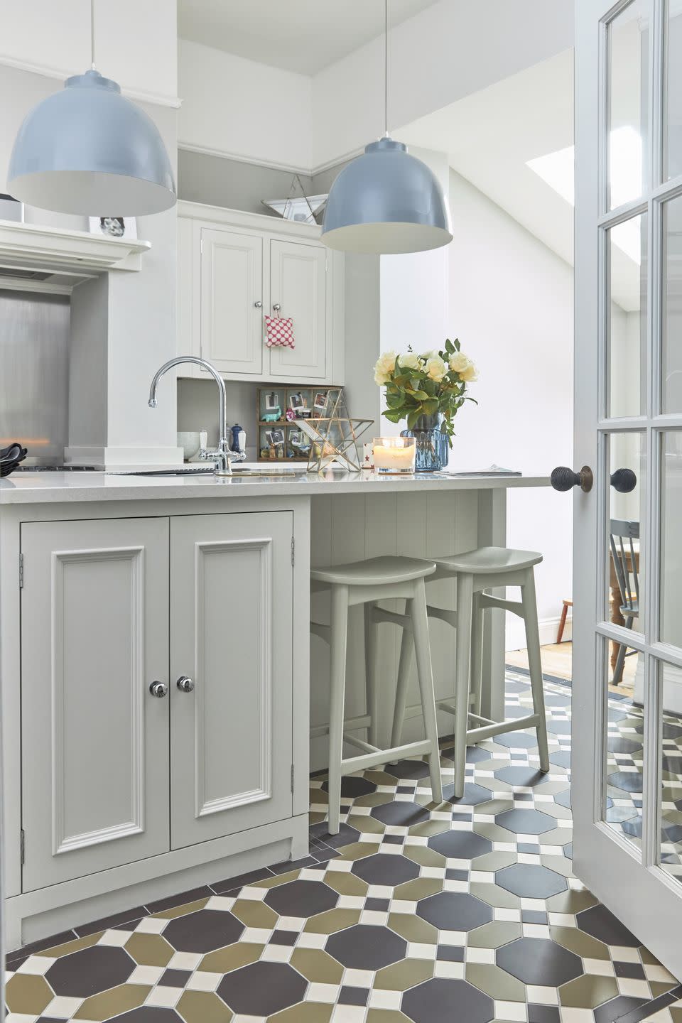 <p>In this kitchen, it seems that spring has sprung. A wash of pastel green sits with the palest sky blue and buttery yellow accents for an effect that makes a functional room altogether more welcoming and homely. </p><p>Pictured: <a href="https://www.originalstyle.com/victorian-floor-tiles/patterns/harrogate/" rel="nofollow noopener" target="_blank" data-ylk="slk:Victorian Floor Tiles in Harrogate at Original Style;elm:context_link;itc:0;sec:content-canvas" class="link ">Victorian Floor Tiles in Harrogate at Original Style</a></p>