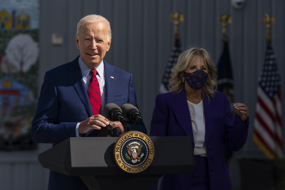 FILE - In this Sept. 10, 2021, President Joe Biden, with first lady Jill Biden, speaks during a visit at Brookland Middle School in northeast Washington. Biden has encouraged every school district to promote vaccines, including with on-site clinics, to protect students as they return to school amid a resurgence of the coronavirus. (AP Photo/Manuel Balce Ceneta, File)