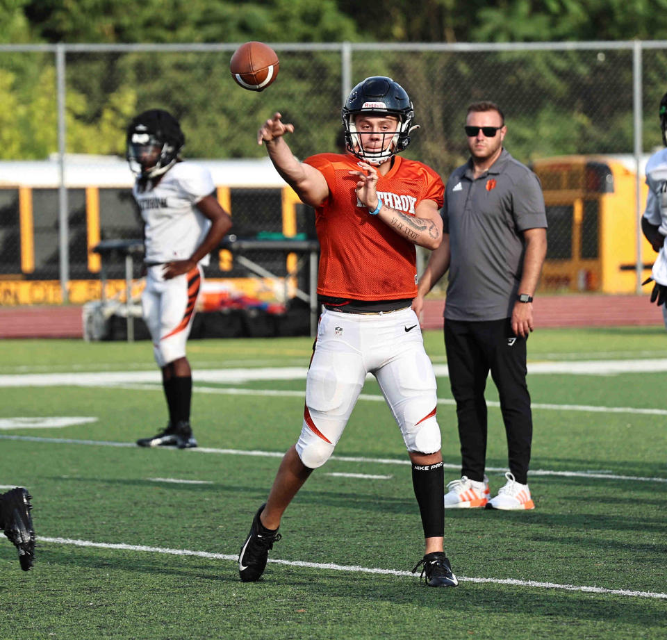 Luke Dunn, Withrow's newest quarterback, has already become familiar with receivers Chris Henry, Jr. and Quinton Simmons.