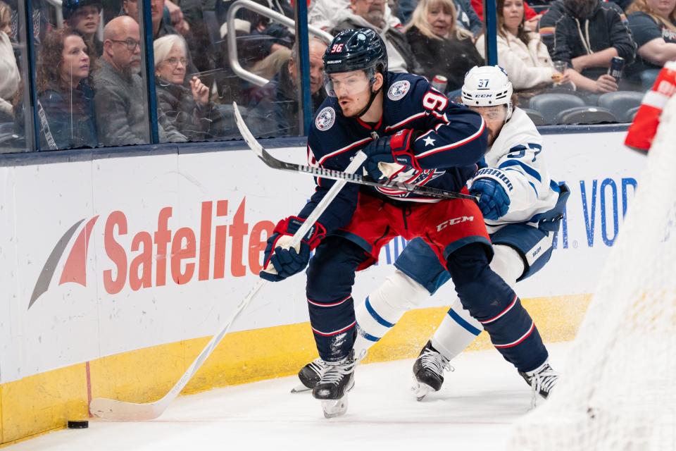 Dec 29, 2023; Columbus, Ohio, USA;
Columbus Blue Jackets center Jack Roslovic (96) fights for the puck against Toronto Maple Leafs defenseman Timothy Liljegren (37) during the first period of their game on Friday, Dec. 29, 2023 at Nationwide Arena.