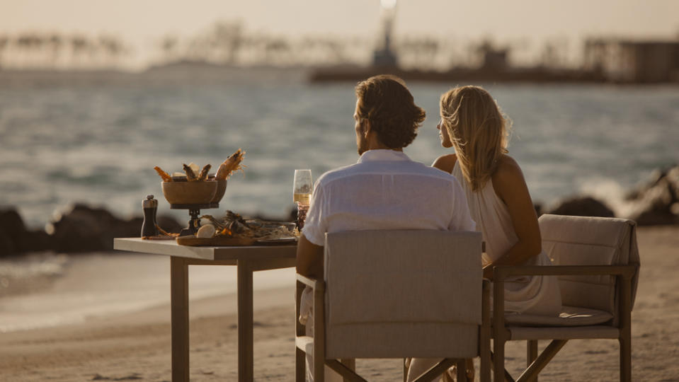 couple dining beach maldives