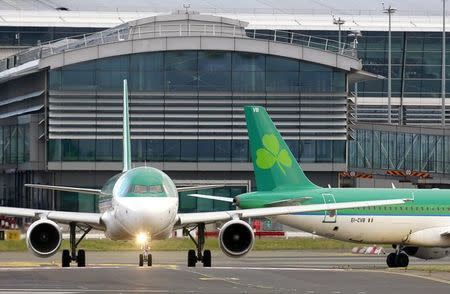 An Aer Lingus plane taxis before take off at Dublin airport January 27, 2015.REUTERS/Cathal McNaughton