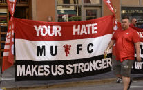 <p>A banner by Manchester United fans for the victims of the Manchester terror attack on May 22, reads: ‘your hate makes us stronger’ in the streets of Stockholm, Sweden, prior the Europa League final against Ajax Amsterdam on Wednesday, May 24, 2017. (AP Photo/Martin Meissner) </p>