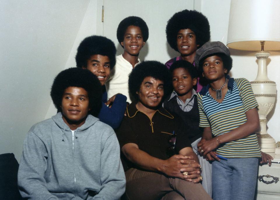 Clockwise from bottom left: Jackie, Tito, Marlon, Jermaine, Michael, Randy and Joe Jackson pictured&nbsp;soon after landing a Motown Records contract. (Photo: Michael Ochs Archives via Getty Images)