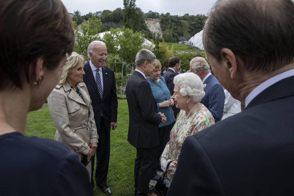 Britain's Queen Elizabeth II, centre. right, speaks to US President Joe Biden, centre left and first lady Jill Biden, at a reception for the G7 leaders at the Eden Project in Cornwall, England, Friday June 11, 2021, during the G7 summit. (Jack Hill/Pool via AP)