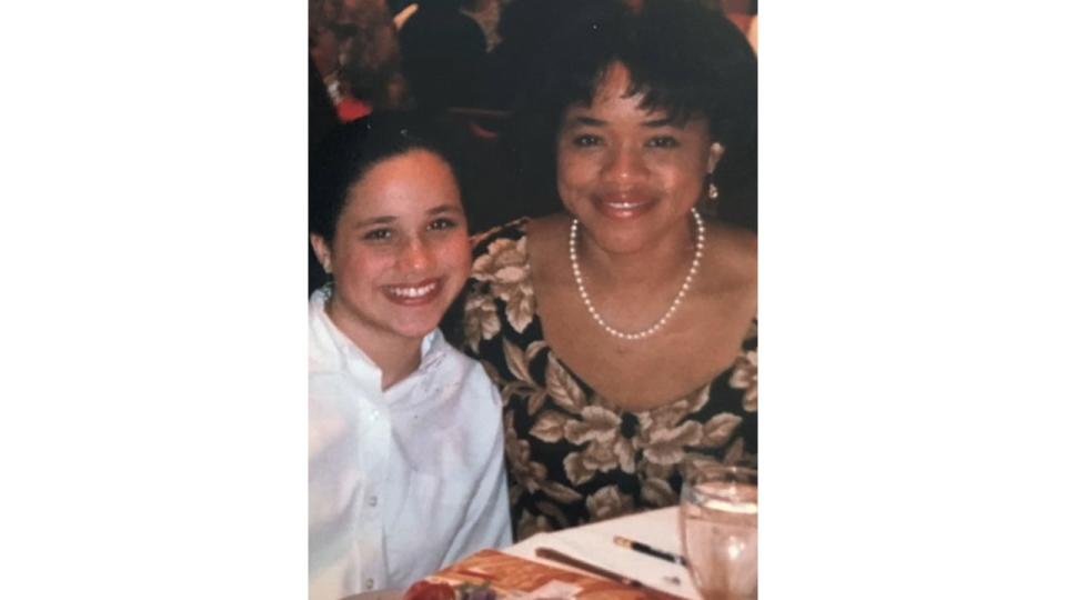 A young Meghan Markle and Doria Ragland at a dinner