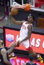 Houston Rockets guard Armoni Brooks (7) dunks against the Los Angeles Clippers during the first quarter of an NBA game Friday, May 14, 2021, in Houston. (Mark Mulligan/Houston Chronicle via AP)