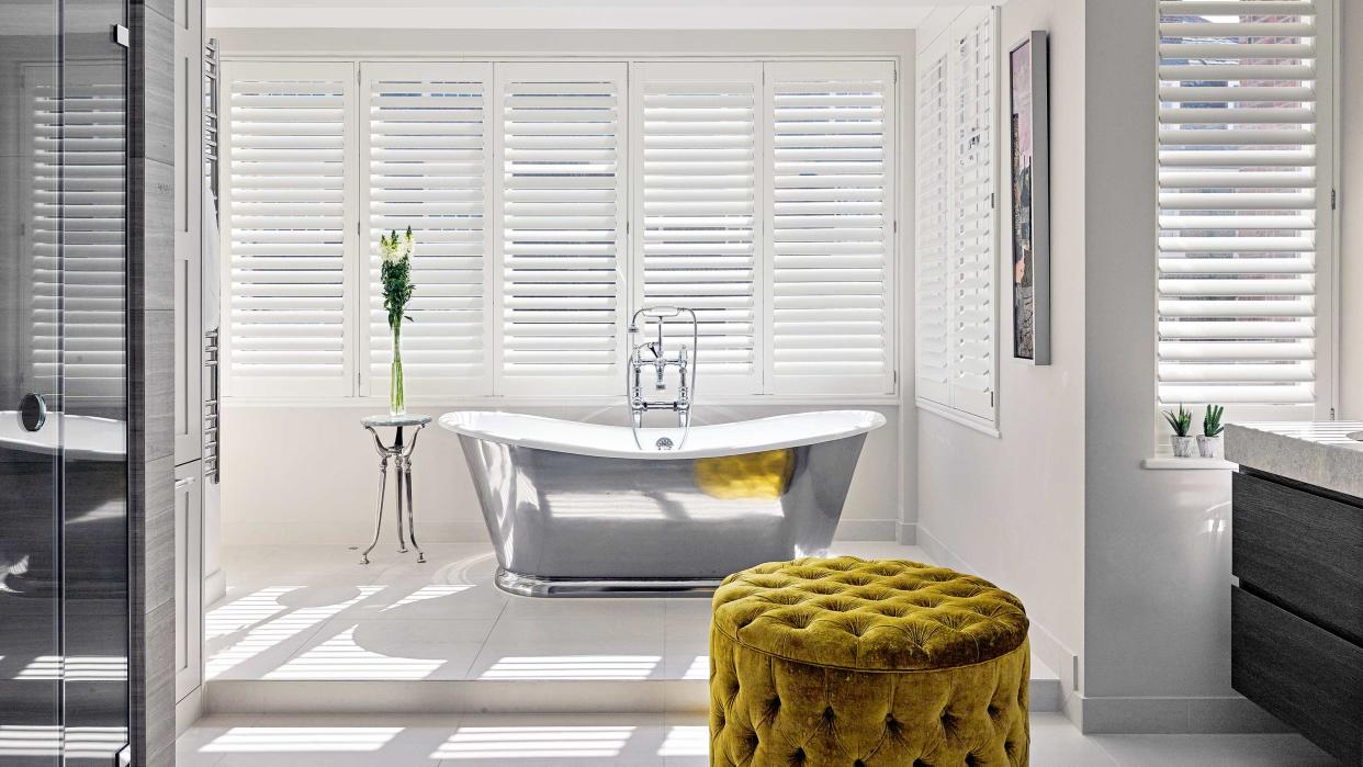  bathroom with window and tub 