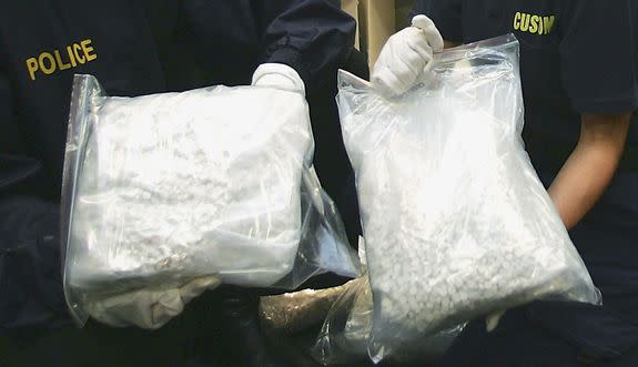 Australian Federal Police in 2005 display more than one ton of MDMA (ecstasy) pills seized from Melbourne's waterfront.