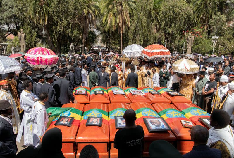 Pallbearers and other people attend the burial ceremony of the Ethiopian Airline Flight ET 302 crash victims at the Holy Trinity Cathedral Orthodox church in Addis Ababa