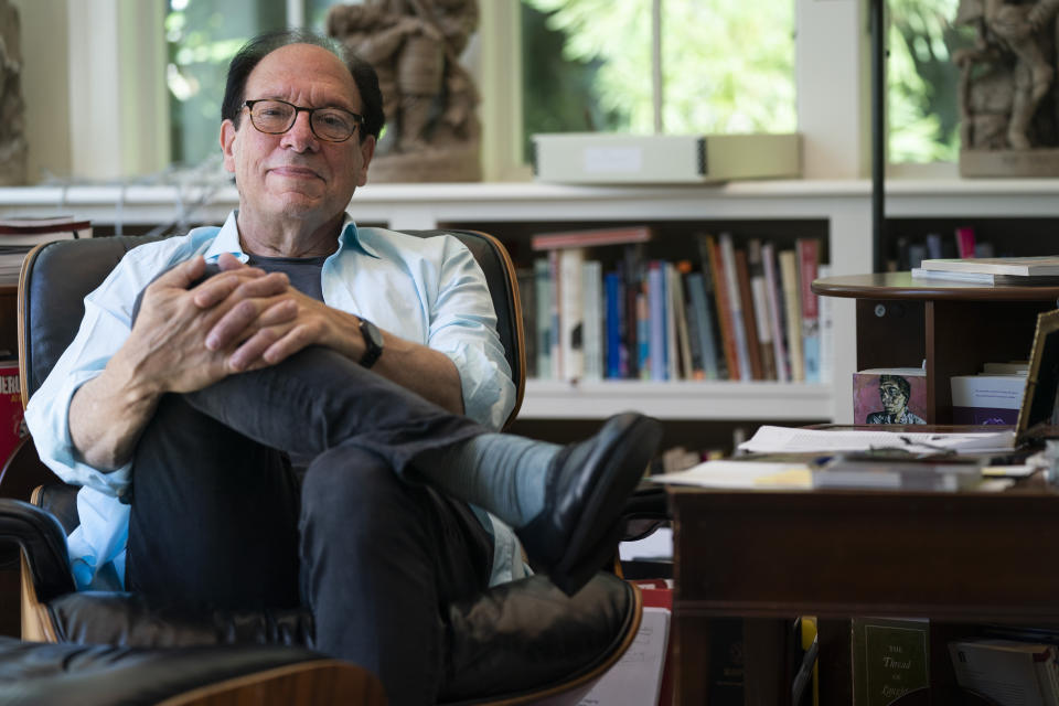 Playwright Ken Ludwig poses for a portrait in his home, Friday, Aug. 12, 2022, in Washington. Ludwig has revisited one of his most beloved plays and flipped the characters’ genders. “Lend Me a Soprano” inverts Ludwig’s madcap screwball comedy “Lend Me a Tenor” by having ladies take the lead three parts, a change he initiated so that a whole new raft of comedians could shine. “Lend Me a Soprano” makes its world premiere this fall at the Ally Theatre in Houston on Sept. 16. (AP Photo/Evan Vucci)