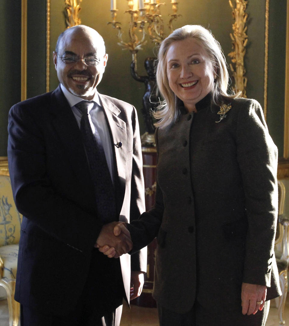 U.S. Secretary of State Hillary Rodham Clinton meets meets Ethiopia's Prime Minister Meles Zenawi, left, at the London Conference on Somalia, Thursday Feb. 23, 2012. World leaders pledged new help to Somalia to tackle terrorism and piracy, but insisted Thursday that the troubled east African nation must quickly install a permanent government and threatened penalties against those who hamper political progress. (AP Photo/Jason Reed, Pool)