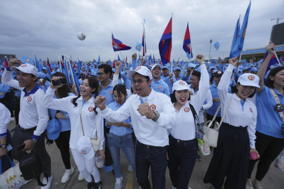 Supporters of the Cambodian People's Party participate in a procession to mark the end of its election campaign in Phnom Penh, Cambodia, Friday, July 21, 2023. The three-week official campaigning period ended Friday for the July 23 general election. Eighteen parties are contesting the polls, but Prime Minister Hun Sen's ruling Cambodian People's Party is virtually guaranteed a landslide victory. (AP Photo/Heng Sinith)
