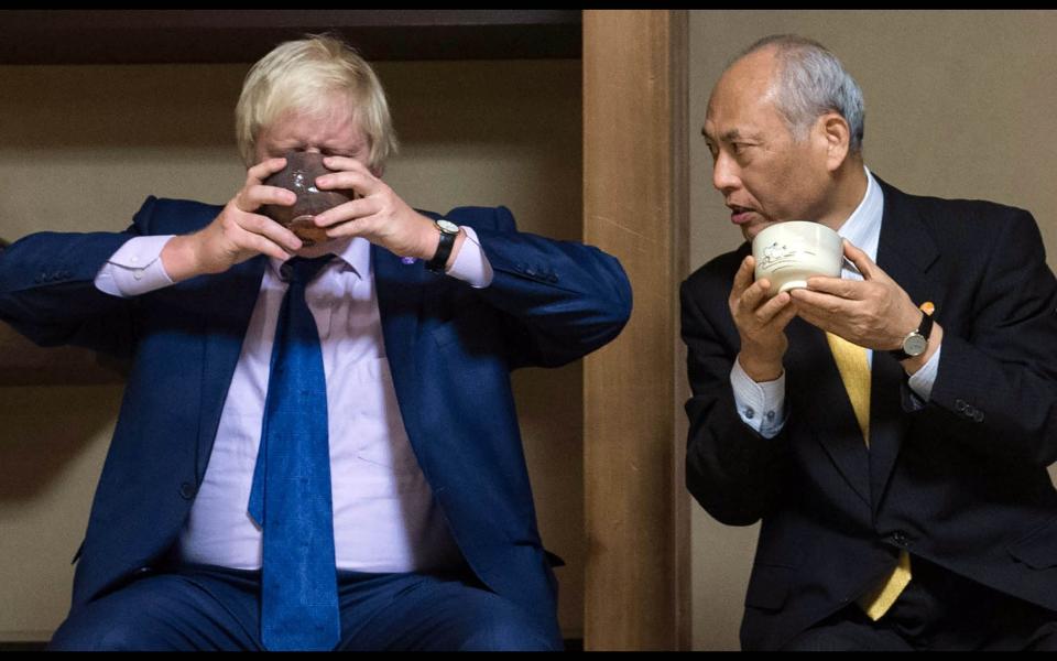 Boris Johnson at a tea ceremony in 2015, while he was Mayor of London, with his Tokyo counterpart Governor Yoichi Masuzoe - Andrew Parsons / i-Images 