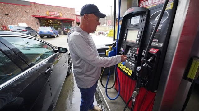 Darryl Matevish of Sewickley, Pa., fills his car at a Sheetz station.