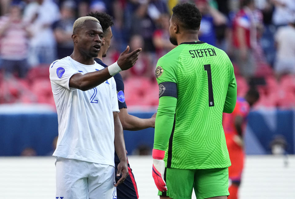 Honduras' Kevin Álvarez (2) argues with United States' Zack Steffen (1) during the second half of a CONCACAF Nations League soccer semfinal Thursday, June 3, 2021, in Denver. (AP Photo/Jack Dempsey)