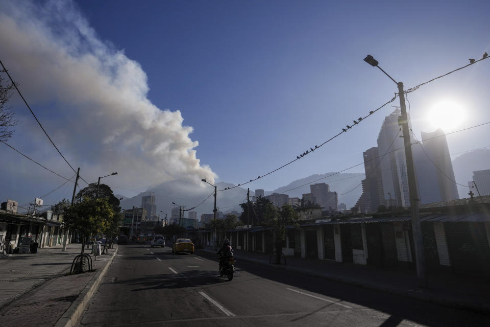 Smoke from a forest fire on El Cable Hill moves over Bogota, Colombia, Thursday, Jan. 25, 2024. (AP Photo/Fernando Vergara)