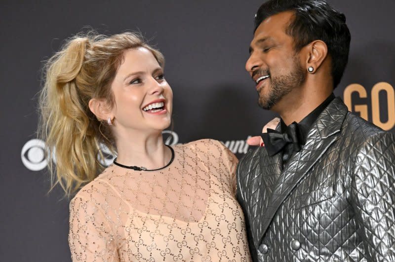 Rose McIver and Utkarsh Ambudkar appear backstage during the 81st annual Golden Globe Awards at the Beverly Hilton in Beverly Hills, Calif., on Sunday. Photo by Chris Chew/UPI