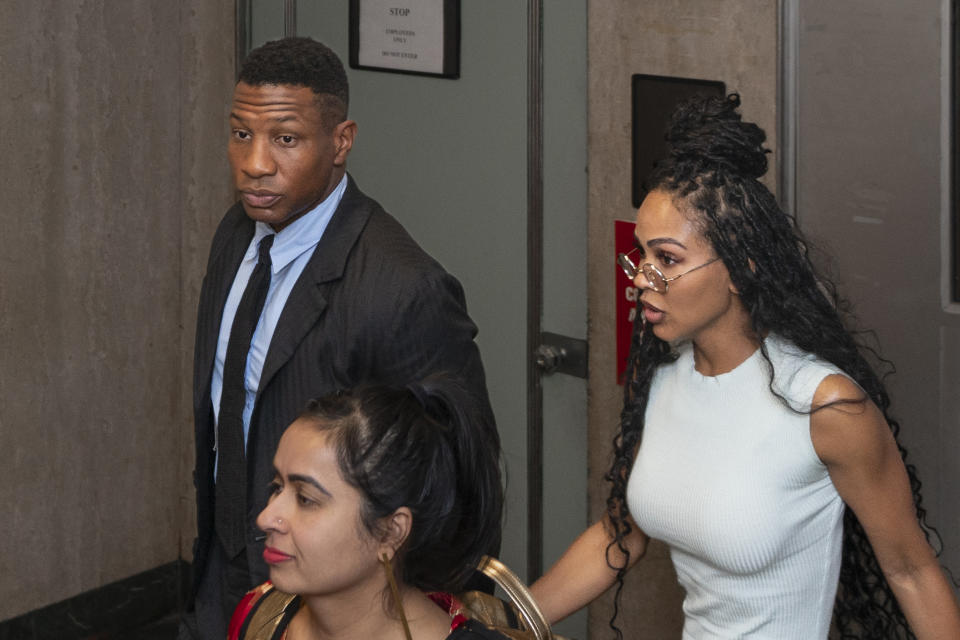 Jonathan Majors, accompanied by girlfriend Meagan Good, exits a courtroom at the Manhattan Criminal Courthouse in New York, Thursday, Dec. 14, 2023. (AP Photo/Peter K. Afriyie)