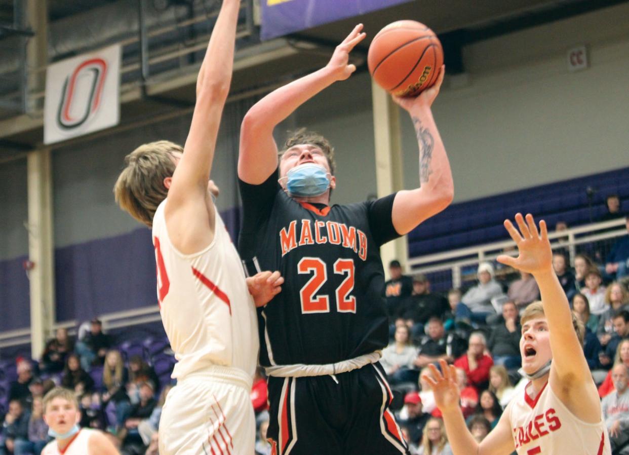 Macomb's Caden Mainland goes up for a basket during play on Wednesday at the Macomb-Western holiday Tournament.