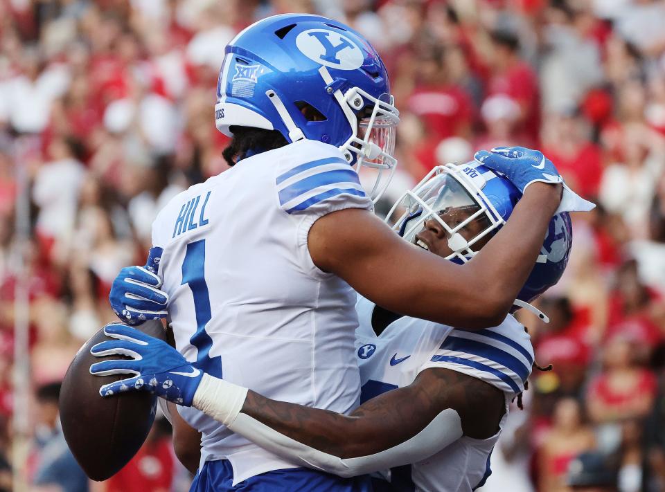 Brigham Young Cougars running back Deion Smith (20) celebrates a touchdown with Brigham Young Cougars wide receiver Keanu Hill (1) against the Arkansas Razorbacks at Razorback Stadium in Fayetteville on Saturday, Sept. 16, 2023. | Jeffrey D. Allred, Deseret News