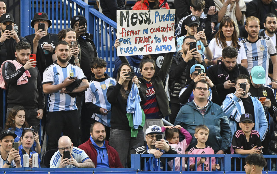 Lionel Messi fans hold up a sign before the Inter Miami's MLS soccer match against CF Montreal on Saturday, May 11, 2024, in Montreal. (Graham Hughes/The Canadian Press via AP)