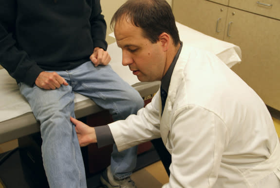 Dr. Joe Rosenthal works with a patient at the fall prevention clinic at The Ohio State University Wexner Medical Center. Fall-related deaths and injuries are skyrocketing among older patients and cost more than $30 billion a year to treat.