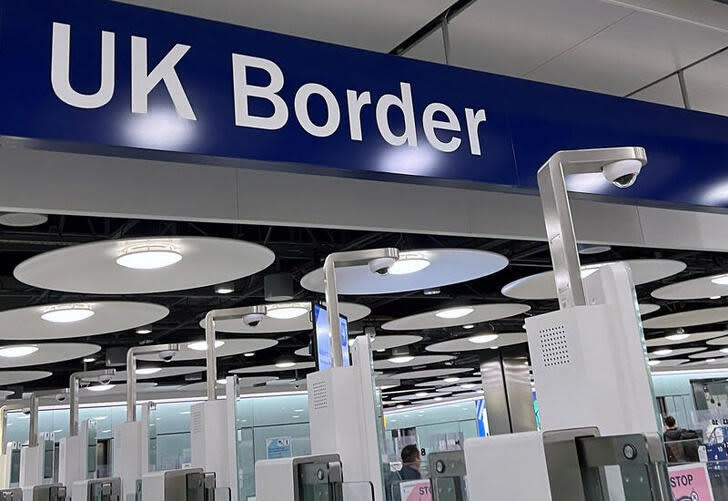 FILE PHOTO: A sign is seen at passport control area of Terminal 5, at Heathrow Airport, London