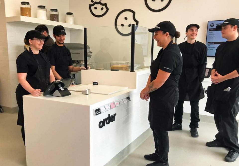 New Crumbl Cookies trainees role-play in preparation for the Friday, March 31, 2023, opening of the chain’s new Paso Robles shop. It will be the first Crumbl Cookies location in San Luis Obispo County.
