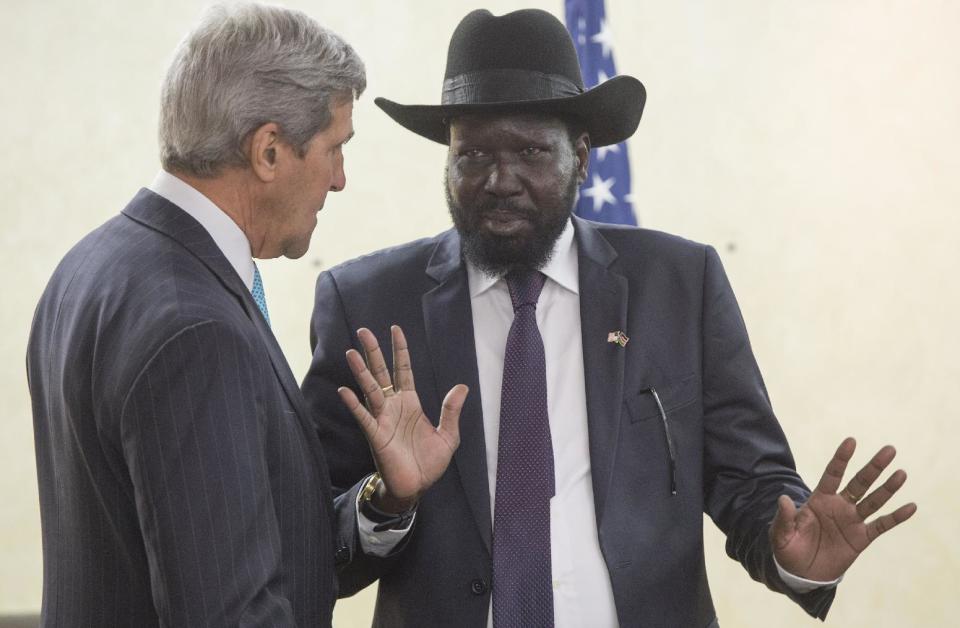 South Sudan's President Salva Kiir, right, chats with U.S. Secretary of State John Kerry as he greets Kerry at the President's Office in Juba, South Sudan, Friday, May 2, 2014. Kerry is urging South Sudan's warring government and rebel leaders to uphold a monthslong promise to embrace a cease-fire or risk the specter of genocide through continued ethnic killings. (AP Photo/Saul Loeb, Pool)