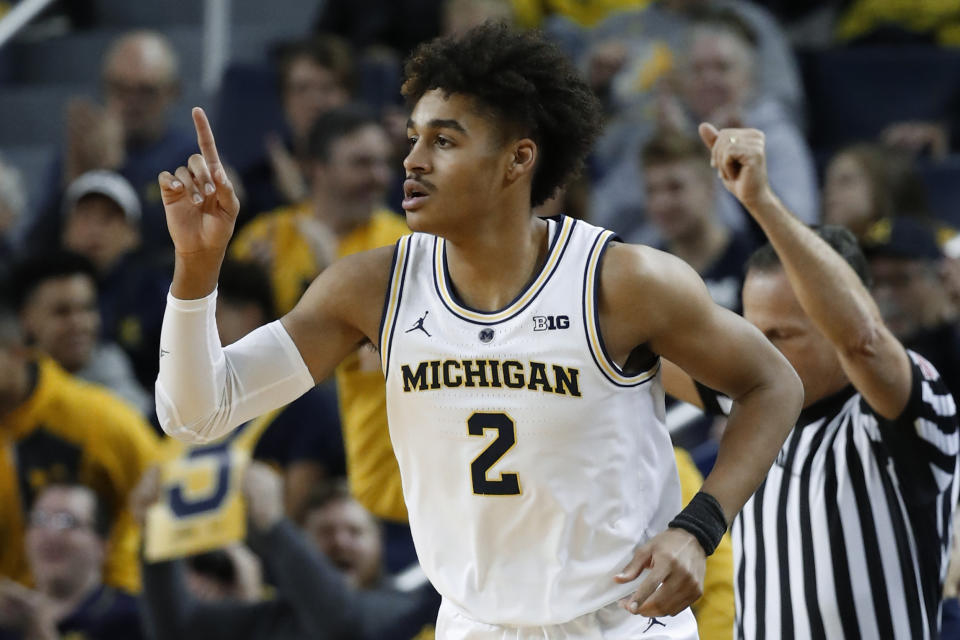 Michigan guard Jordan Poole reacts to hitting a basket against South Carolina in the first half of an NCAA college basketball game in Ann Arbor, Mich., Saturday, Dec. 8, 2018. (AP Photo/Paul Sancya)