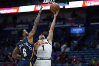 Denver Nuggets guard Facundo Campazzo (7) goes to the basket against New Orleans Pelicans guard Nickeil Alexander-Walker (6) in the first half of an NBA basketball game in New Orleans, Wednesday, Dec. 8, 2021. (AP Photo/Gerald Herbert)