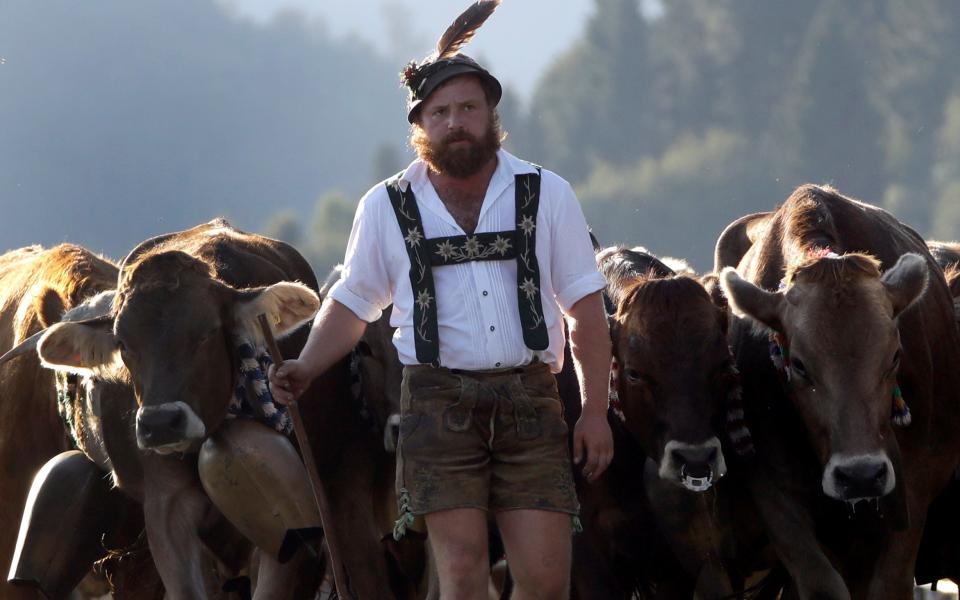 A Bavarian herdsman in traditional dress - Credit: AP Photo/Matthias Schrader