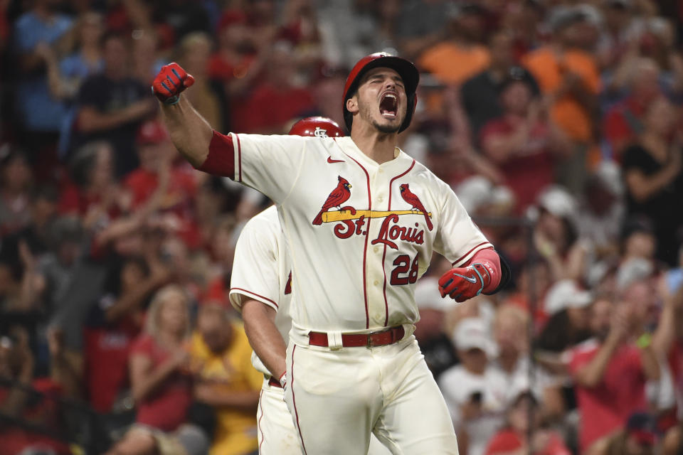 St. Louis Cardinals' Nolan Arenado reacts after hitting a two-run home run during the eighth inning of a baseball game against the Cincinnati Reds on Saturday, Sept. 11, 2021, in St. Louis. (AP Photo/Joe Puetz)