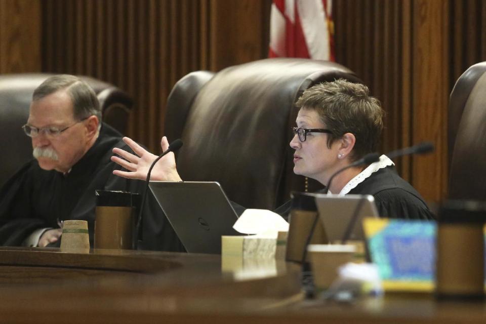 Kansas Supreme Court Justice Carol Beier asks questions Thursday, March 16, 2017, during oral arguments in a legal fight over a state law banning a second-trimester abortion procedure and the larger question of whether the state constitution's Bill of Rights offered a fundamental right to an abortion. (Thad Allton/The Topeka Capital-Journal via AP, Pool)