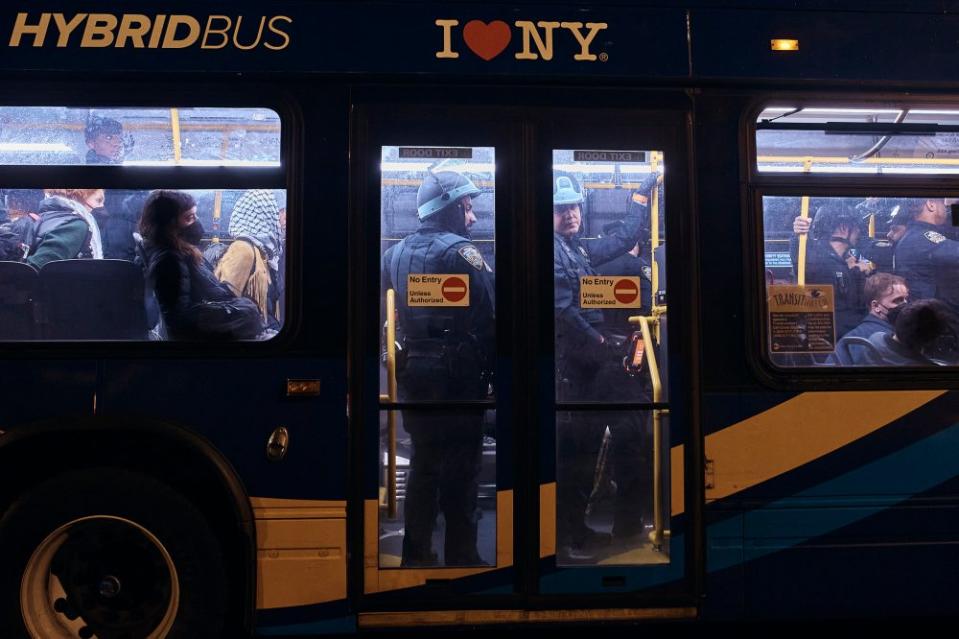 Arrested protestors are taken away by bus outside The City College of New York.<span class="copyright">Andres Kudacki for TIME</span>